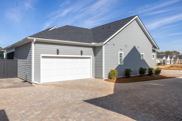 view of side of property with a garage