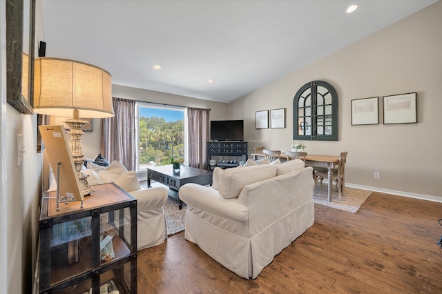 living area with lofted ceiling, dark wood-style flooring, baseboards, and recessed lighting