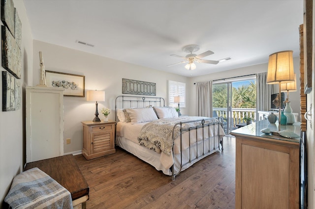 bedroom featuring access to outside, dark wood finished floors, visible vents, and a ceiling fan