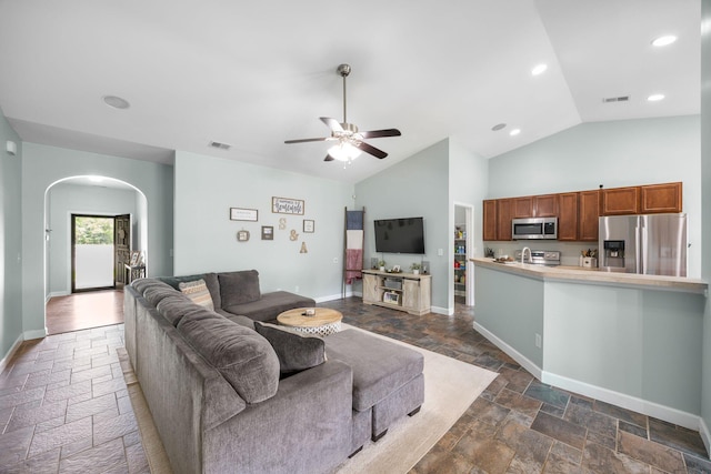 201 Maywood Dr, Moncks Corner, SC 29461 - living area with stone tile floors, arched walkways, ceiling fan, recessed lighting, and high vaulted ceiling