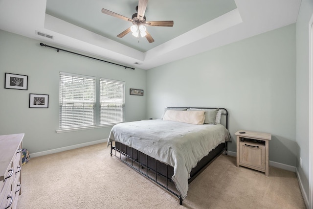 201 Maywood Dr, Moncks Corner, SC 29461 - bedroom featuring a raised ceiling, light colored carpet, and a ceiling fan