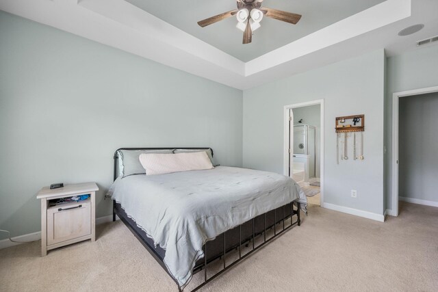 201 Maywood Dr, Moncks Corner, SC 29461 - bedroom with a tray ceiling, light colored carpet, ensuite bath, and a ceiling fan
