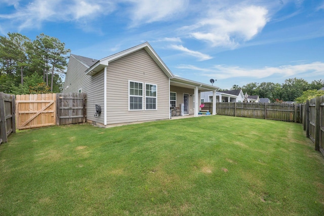 201 Maywood Dr, Moncks Corner, SC 29461 - back of property featuring a fenced backyard, a patio, and a gate