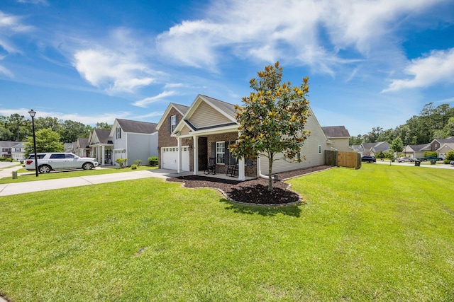 201 Maywood Dr, Moncks Corner, SC 29461 - view of front facade featuring concrete driveway, a front yard, brick siding, a residential view, and a porch