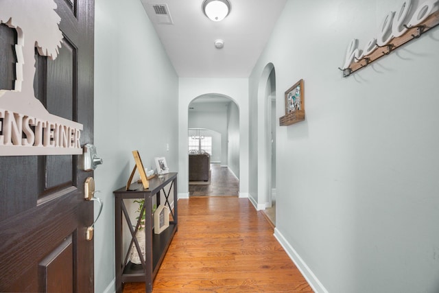 201 Maywood Dr, Moncks Corner, SC 29461 - corridor with arched walkways and light wood-style flooring