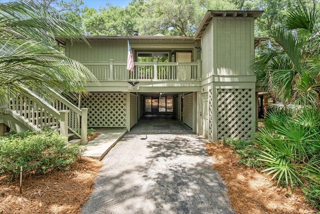 1025 Scaup Ct, Kiawah Island, SC 29455 - view of front of home featuring a carport, driveway, and stairs