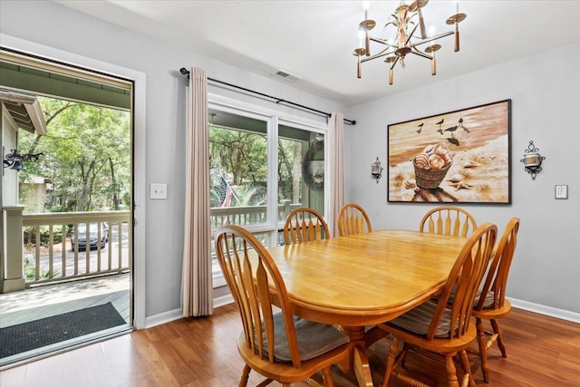 1025 Scaup Ct, Kiawah Island, SC 29455 - dining space featuring a chandelier and wood finished floors
