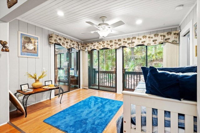 1025 Scaup Ct, Kiawah Island, SC 29455 - bedroom featuring access to exterior, multiple windows, ornamental molding, wood finished floors, and wood ceiling