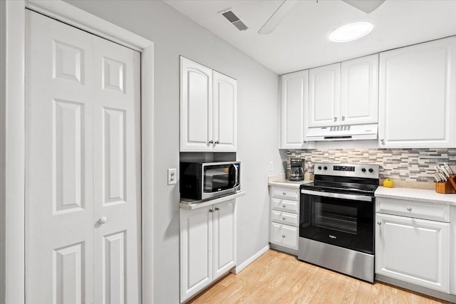 1025 Scaup Ct, Kiawah Island, SC 29455 - kitchen with stainless steel appliances, under cabinet range hood, and white cabinetry
