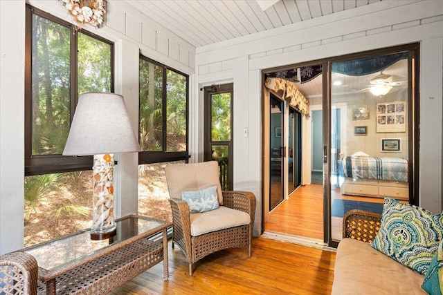 1025 Scaup Ct, Kiawah Island, SC 29455 - sunroom / solarium featuring wood finished floors, a ceiling fan, and wooden walls