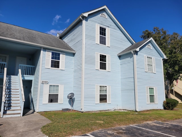 2030 Coldspring Dr Unit 707G, North Charleston, SC 29406 - view of side of property with stairway and uncovered parking