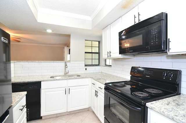 kitchen featuring a textured ceiling, black appliances, sink, decorative backsplash, and white cabinets