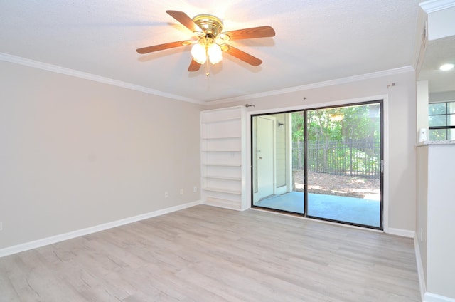 spare room with ceiling fan, ornamental molding, and light wood-type flooring