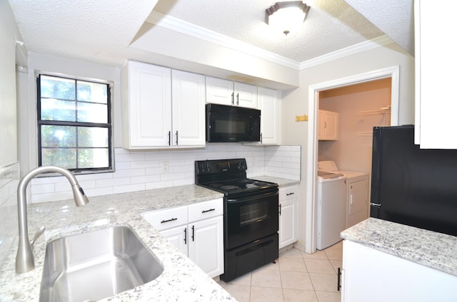 kitchen with independent washer and dryer, sink, black appliances, decorative backsplash, and a textured ceiling