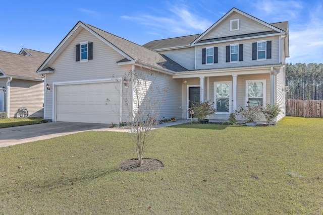 view of property featuring a front lawn and a garage