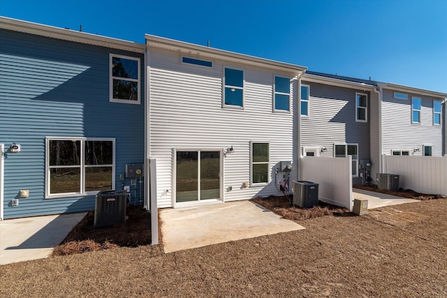 back of house with central AC, a patio, and fence