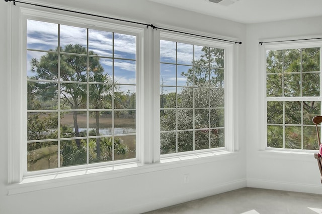 unfurnished sunroom featuring visible vents and a wealth of natural light