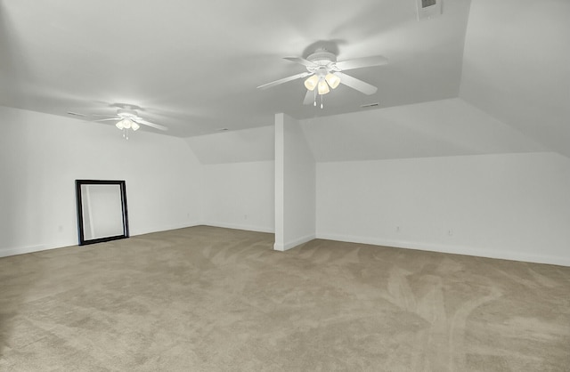 bonus room with lofted ceiling, visible vents, ceiling fan, and carpet flooring