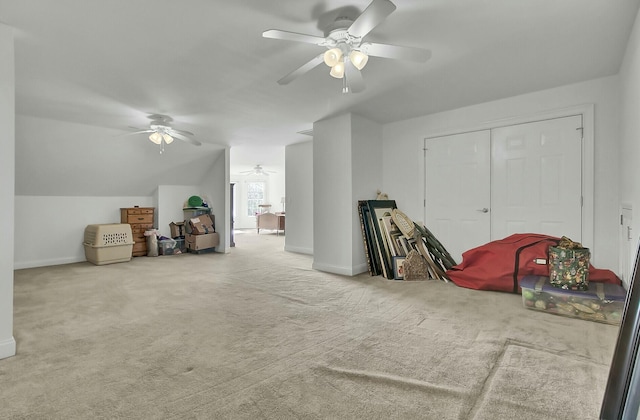 bonus room featuring lofted ceiling, carpet, and baseboards