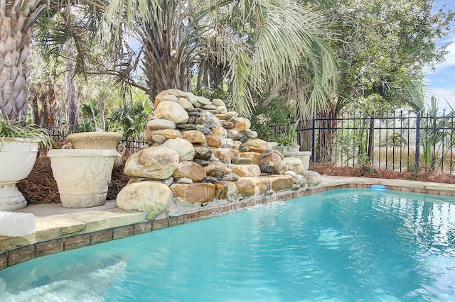 view of pool featuring fence and a fenced in pool