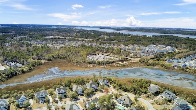 bird's eye view featuring a water view and a residential view