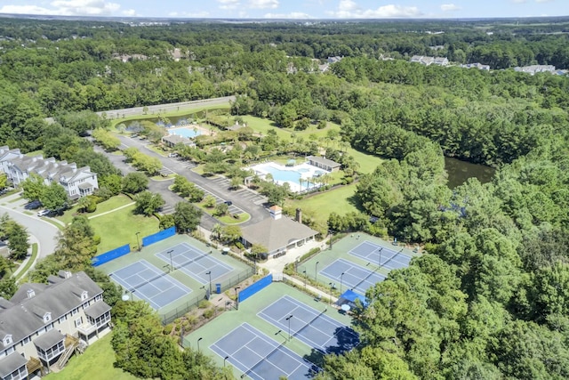 birds eye view of property with a view of trees