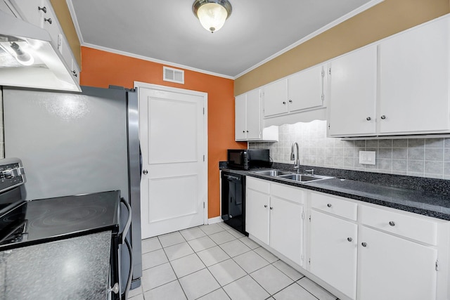 kitchen with black appliances, tasteful backsplash, visible vents, and a sink