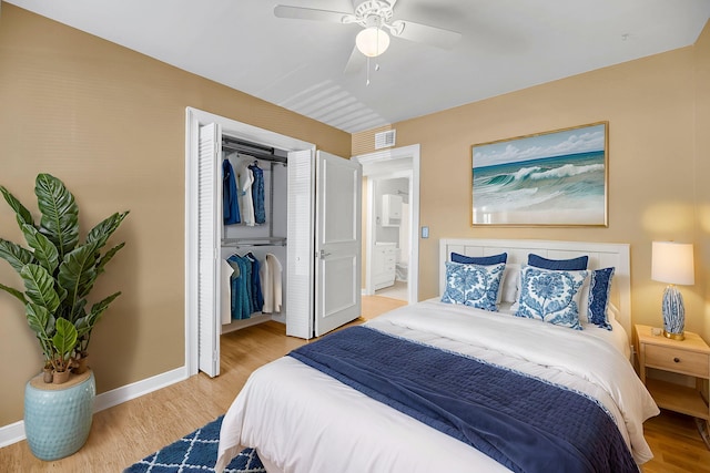 bedroom with a closet, visible vents, a ceiling fan, light wood-type flooring, and baseboards