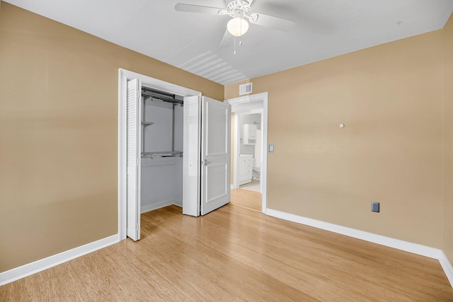 unfurnished bedroom featuring visible vents, light wood-style flooring, and baseboards