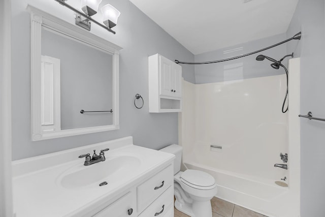 full bath with shower / bath combination, tile patterned floors, toilet, and vanity