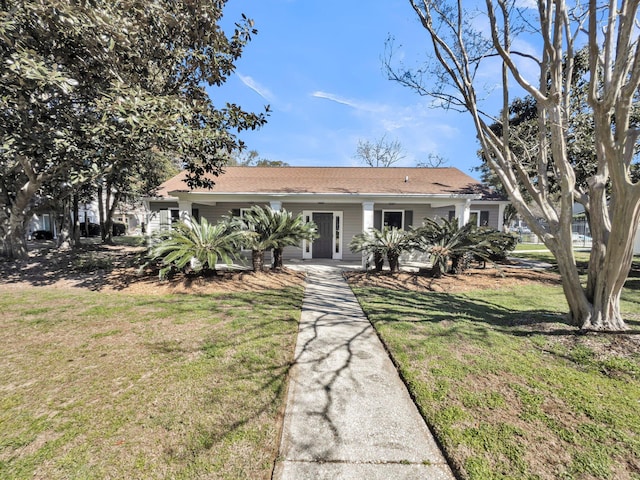 ranch-style home featuring a front yard