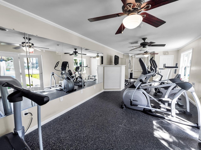 gym with baseboards, visible vents, and ornamental molding