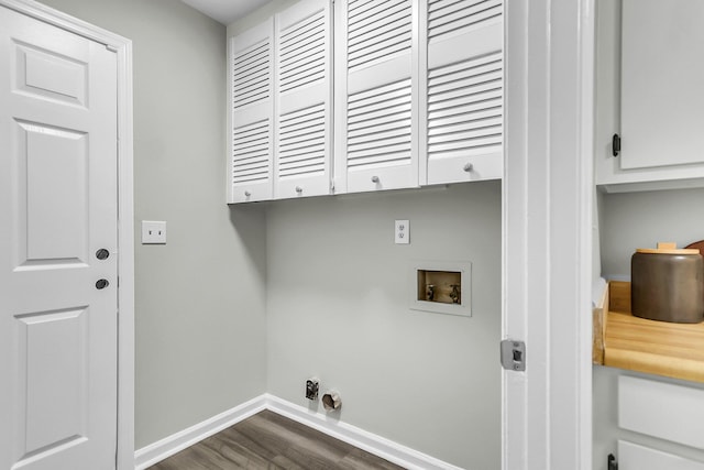 clothes washing area featuring baseboards, hookup for an electric dryer, cabinet space, washer hookup, and dark wood-type flooring