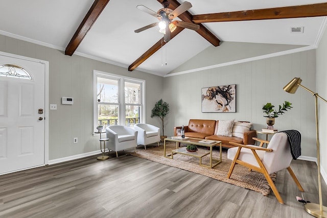 interior space featuring visible vents, baseboards, lofted ceiling with beams, wood finished floors, and a ceiling fan