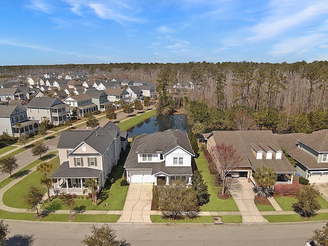 birds eye view of property featuring a residential view and a water view