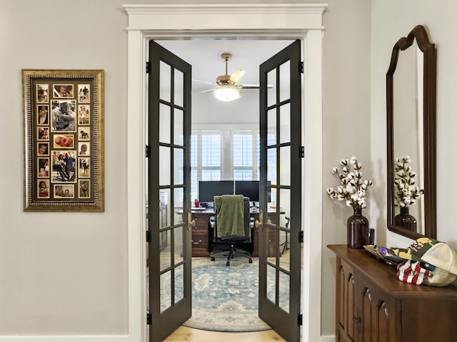 doorway to outside featuring french doors and ceiling fan