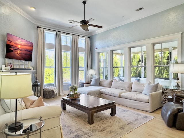 living area featuring visible vents, crown molding, ceiling fan, and wood finished floors