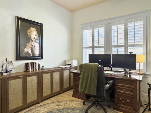 home office featuring light wood-style flooring