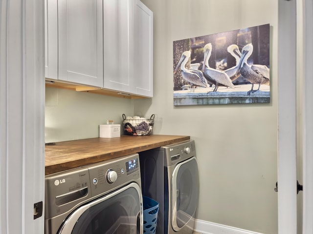 laundry area with cabinet space and washing machine and dryer