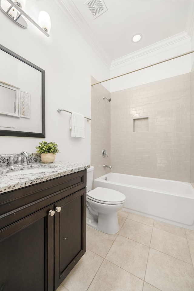 full bathroom with tiled shower / bath combo, vanity, toilet, crown molding, and tile patterned floors