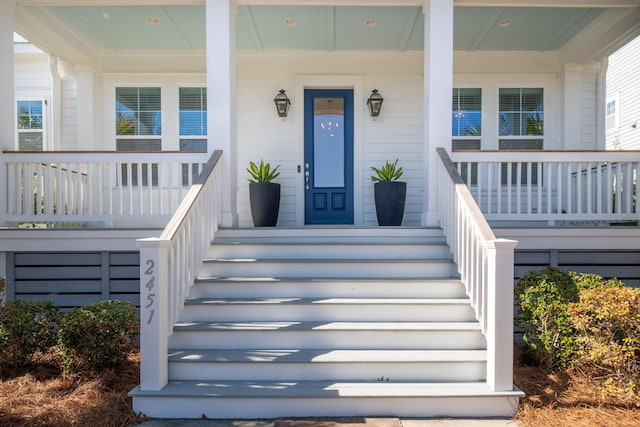 entrance to property with a porch