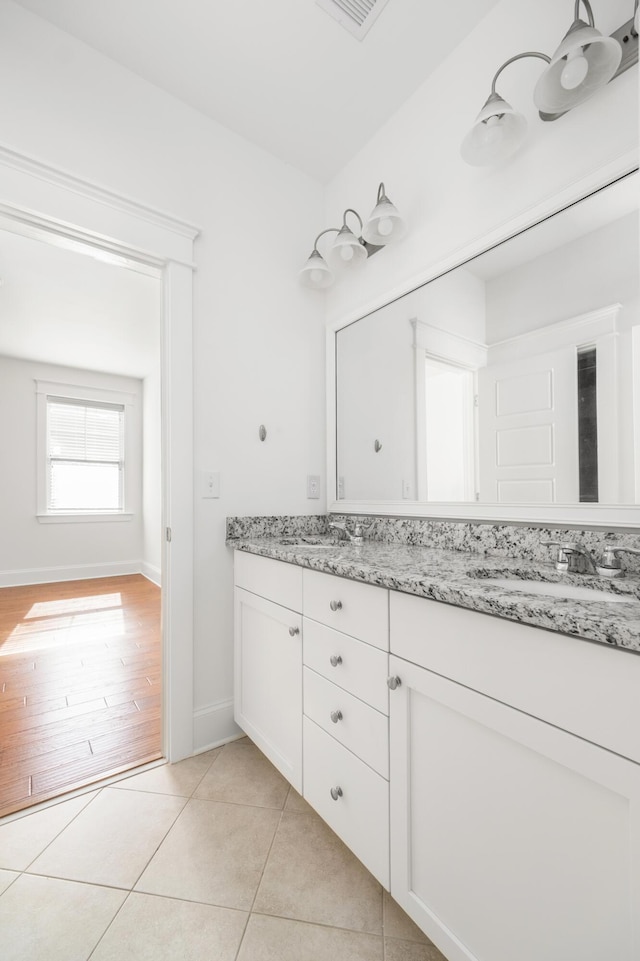 bathroom with tile patterned floors and vanity