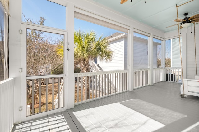 sunroom / solarium with ceiling fan