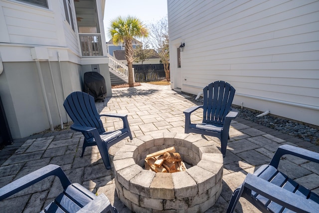 view of patio / terrace featuring an outdoor fire pit