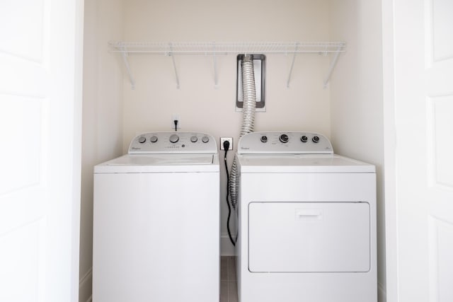 clothes washing area featuring washing machine and dryer