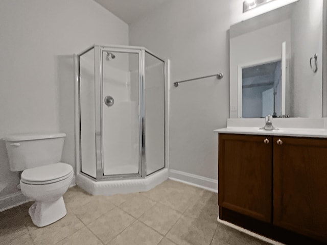 bathroom featuring toilet, tile patterned flooring, a shower with shower door, and vanity