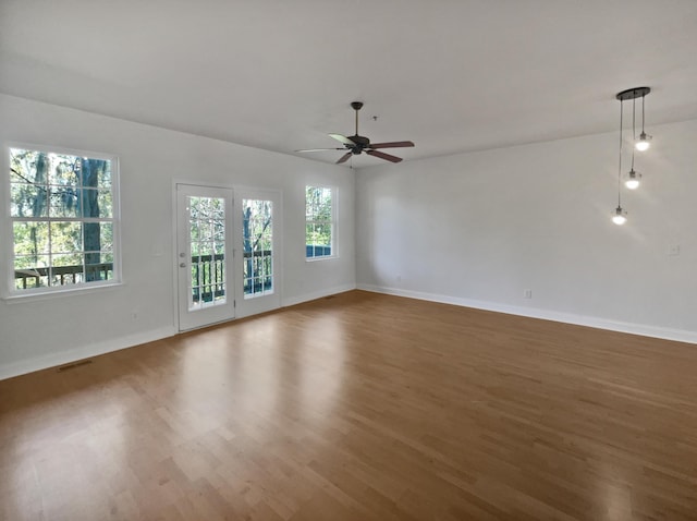 spare room with ceiling fan and hardwood / wood-style floors