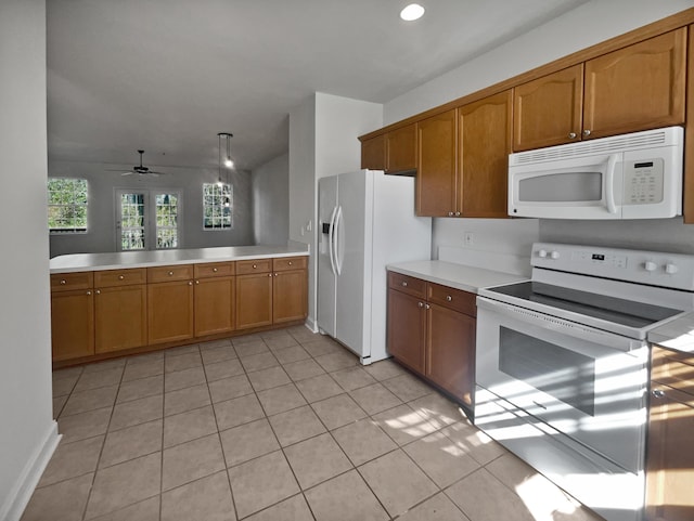 kitchen featuring pendant lighting, white appliances, kitchen peninsula, ceiling fan, and light tile patterned floors