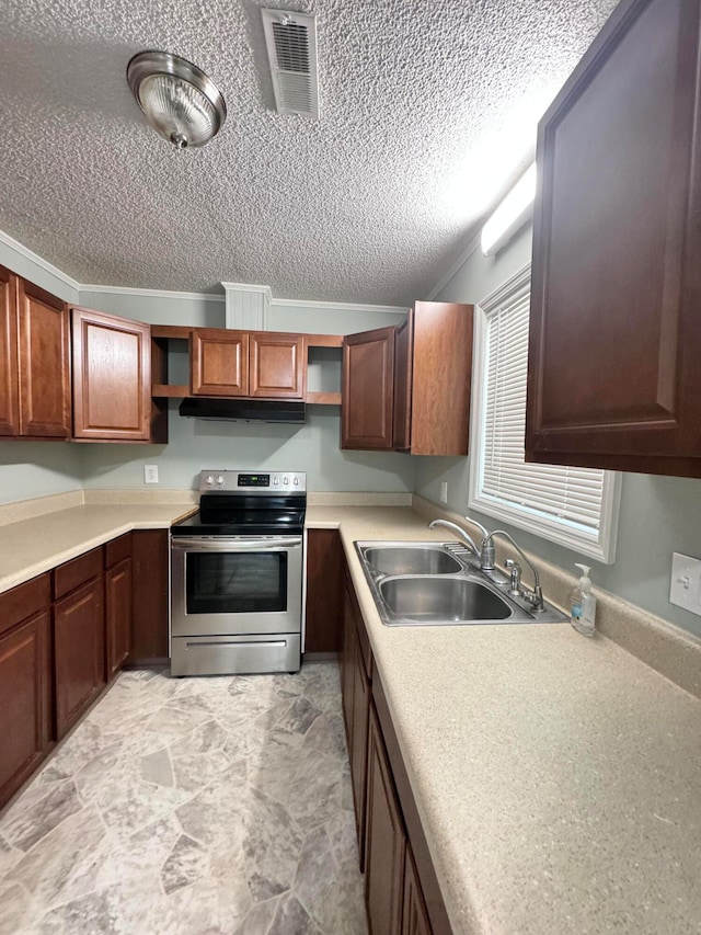 kitchen with a textured ceiling, electric range, light tile patterned floors, and sink