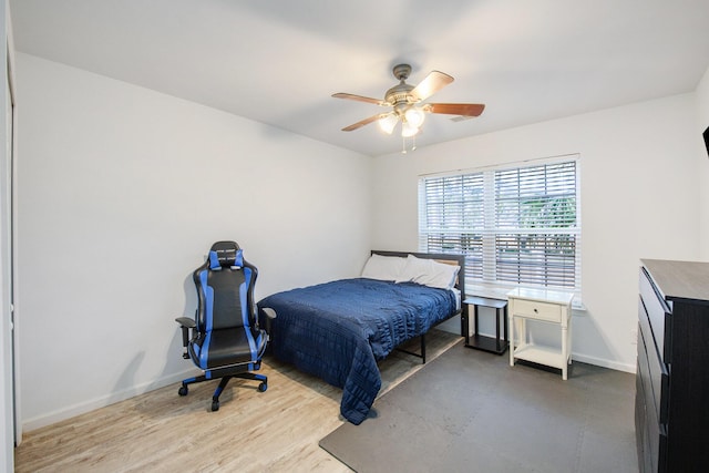 bedroom featuring hardwood / wood-style flooring and ceiling fan